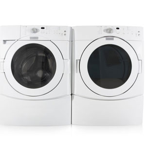 Two white washer and dryer machines side by side.