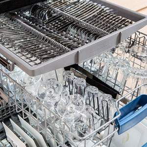 A dishwasher with many glasses in it