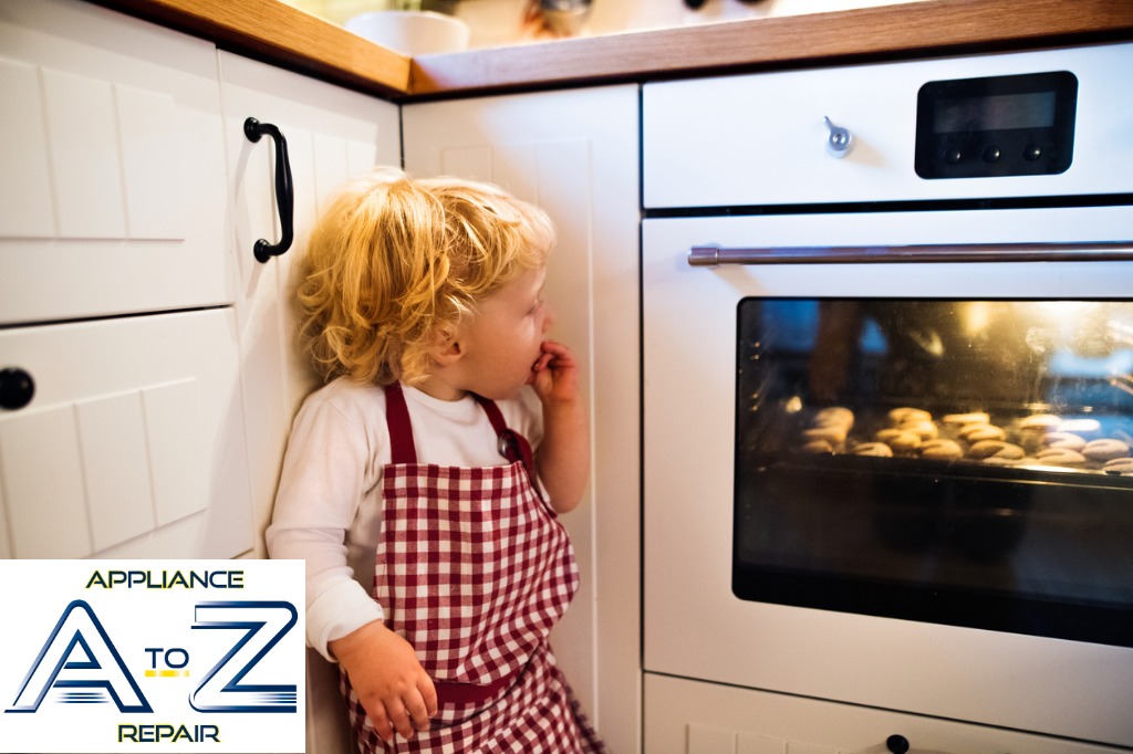 A child in an apron looking into the oven.